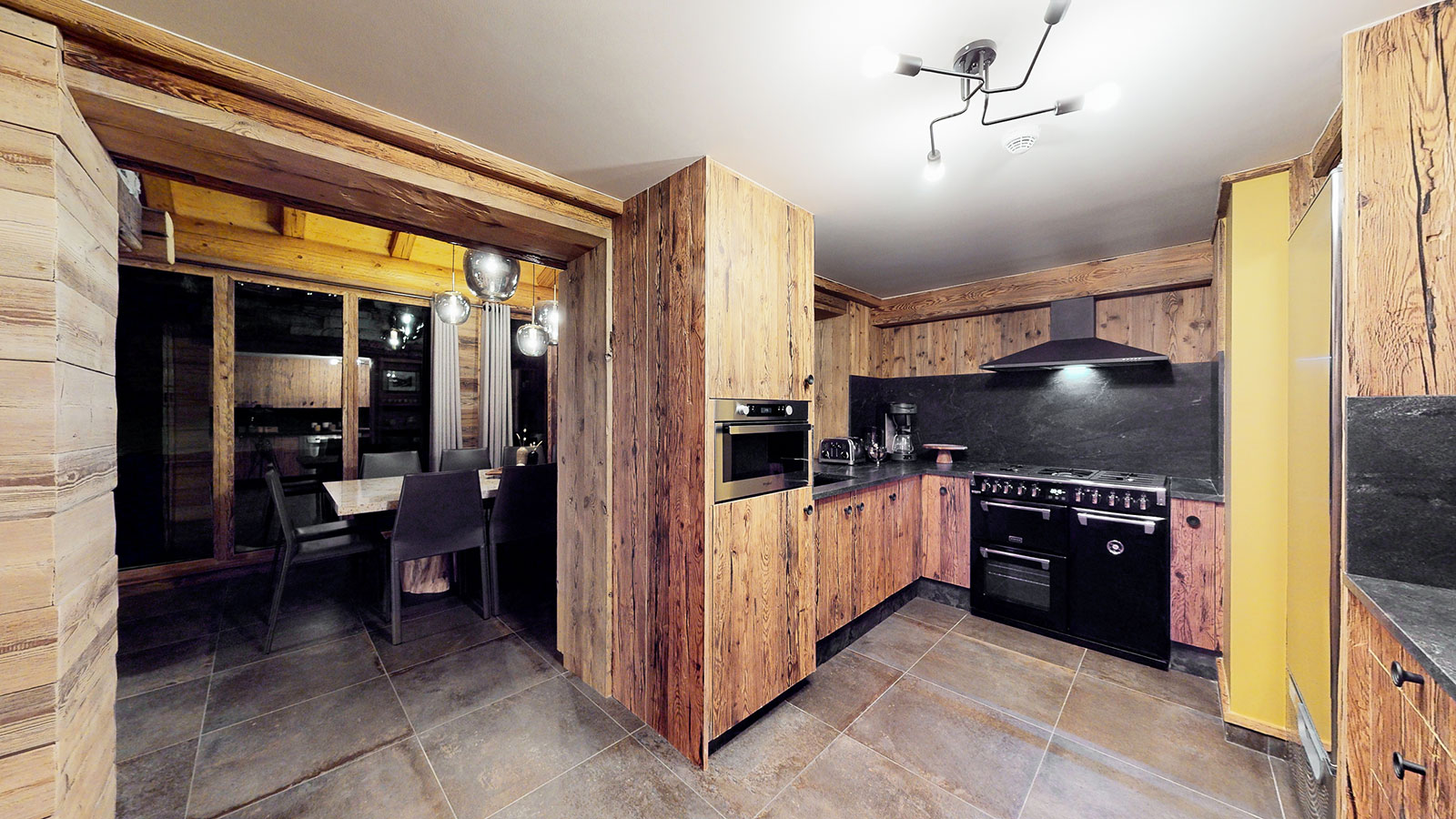 Close-up of the open kitchen at Chalet La Marsa with bar and high-end appliances